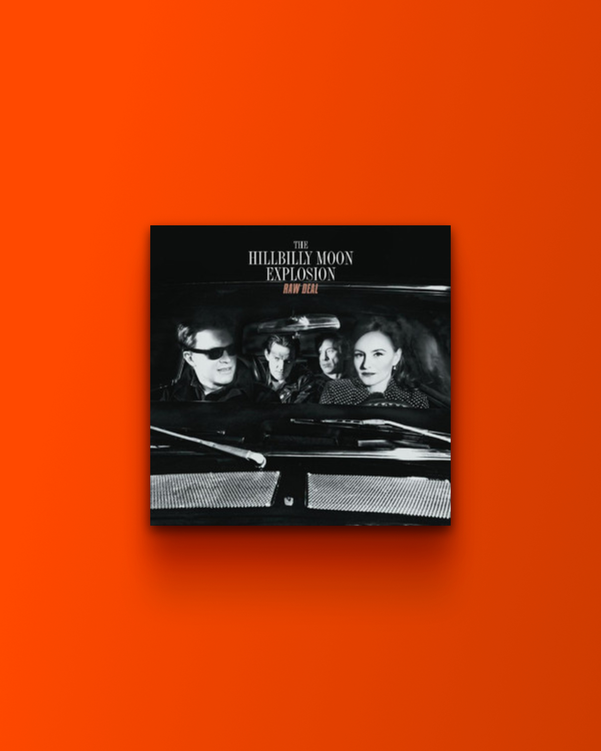A photo of the album cover for "Raw Deal" by The Hillbilly Moon Explosion, featuring the band members in a vintage car, set against a solid orange background.